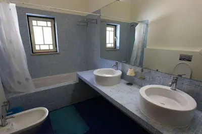 a bathroom with two sinks and a tub and a mirror at Amazing Portuguese Villa Villa Heroine 6 Bedrooms Stunning Position in Albufeira