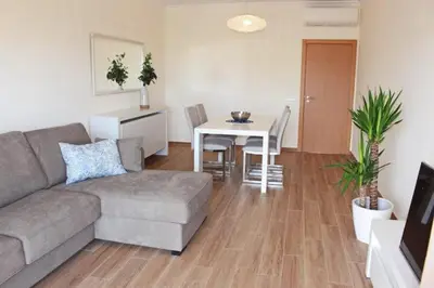 a living room with a couch and a table at Apartment Amelo in Albufeira