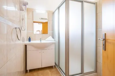 a bathroom with a sink and a shower at Villa Amaris by Atlantic Places in Albufeira