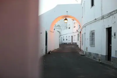 an empty alley with an archway in a building at Apartment Aiko - Downtown Albufeira in Albufeira