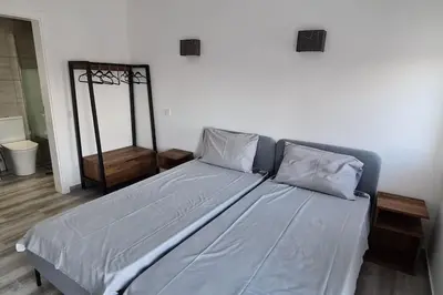 a bed with blue sheets and pillows in a room at Villa Garden - 22 Guests - 2 Pools in Albufeira