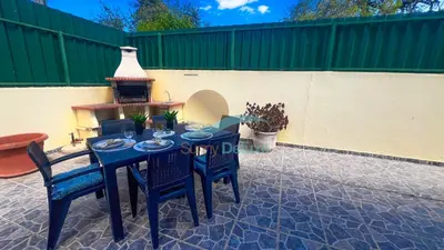 a blue table and chairs on a patio at Villa Pedro by Sunny Deluxe in Albufeira