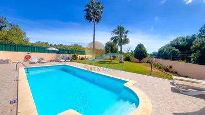 a swimming pool in the backyard of a house at Villa Pedro by Sunny Deluxe in Albufeira