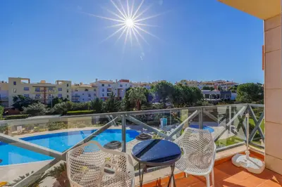 a balcony with a view of a swimming pool at Albufeira Corcovada Apartments in Albufeira