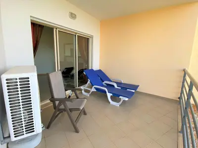 a room with chairs and a air conditioner at SeaViewSunset - Encosta da Orada in Albufeira