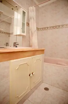 a bathroom with a sink and a bath tub at Villa Juniper fenced pool spacious house in Albufeira