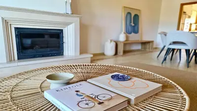 a living room with a coffee table with a book at Adam's Place (Garça Real)CD242 - Clever Details, Sleeps 4 people, Wifi, Garage in Vilamoura