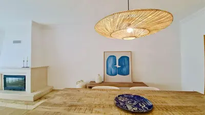 a dining room with a table and a chandelier at Adam's Place (Garça Real)CD242 - Clever Details, Sleeps 4 people, Wifi, Garage in Vilamoura