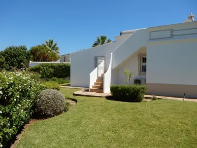 a white house with a yard at Celina by Algarve Villa Holidays in Guia