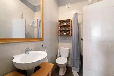 a bathroom with a sink and a toilet and a shower at Casa da Cidade de Loulé in Loulé