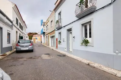 a car parked on a street between two buildings at Casa da Cidade de Loulé in Loulé