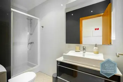 a bathroom with a sink and a shower and a toilet at Quinta do Pinheiro Residence AN - Dream Lodging in Albufeira