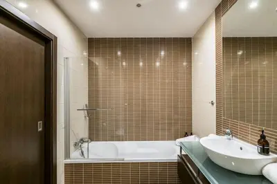 a bathroom with a tub and a sink and a bath tub at Albufeira Old Town Center - VERASOL 2 in Albufeira