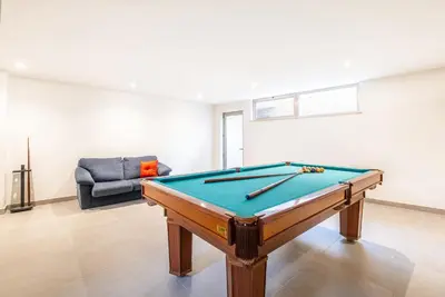 a pool table in a living room with a couch at Villa Laura by Algarve Vacation in Albufeira