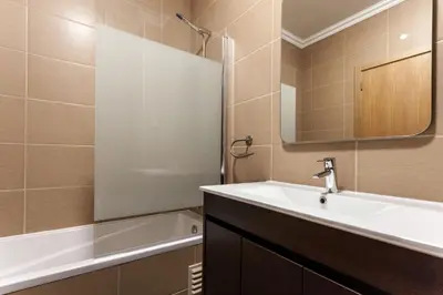 a bathroom with a sink and a mirror and a tub at Apartment Aria - Great area for children in Albufeira