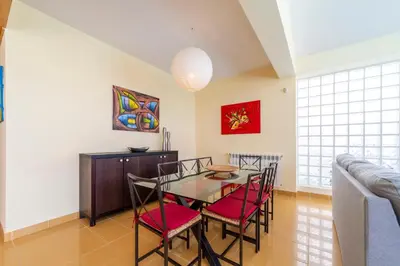 a dining room with a table and chairs at Villa Marina in Albufeira