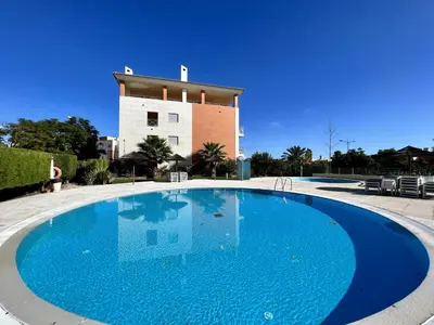 a large blue swimming pool in front of a building at Albufeira Modern 3 With Pool by Homing in Albufeira