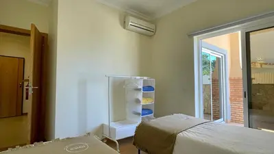 a room with a bedroom with a bed and a window at Oura Oasis B by Check-in Portugal in Albufeira