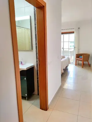 a bathroom with a sink and a mirror in a room at Sao Rafael Beach Luxury Home by Be Cherish in Albufeira