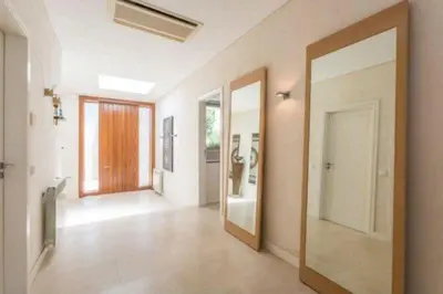 an empty room with a hallway with a door at Villa Atlantic Pearl - Luxury villa located in in Quinta do Lago