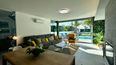 a living room with a couch and a table at Moon by Check-in Portugal in Albufeira