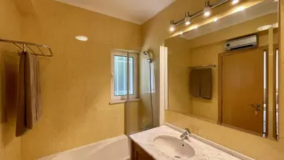 a bathroom with a sink and a mirror at Azaleas by Check-in Portugal in Vilamoura
