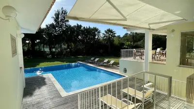 a house with a swimming pool in the backyard at Azaleas by Check-in Portugal in Vilamoura