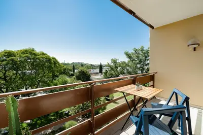a balcony with a table and two chairs on it at Estúdio do Largo - Vilamoura in Vilamoura