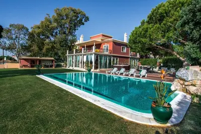 a house with a swimming pool in the yard at Villa Mauri Luxe - Beautiful beachfront villa in Albufeira