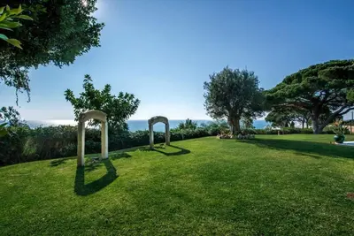 a park with two arches in the grass at Villa Mauri Luxe - Beautiful beachfront villa in Albufeira