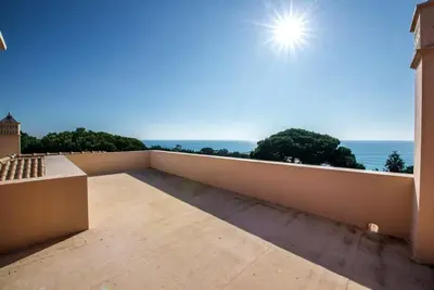 a balcony with a view of the ocean at Villa Mauri Luxe - Beautiful beachfront villa in Albufeira