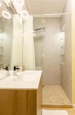 a bathroom with a white sink and a shower at Eine Wohnung für den perfekten Urlaub !!! in Quarteira