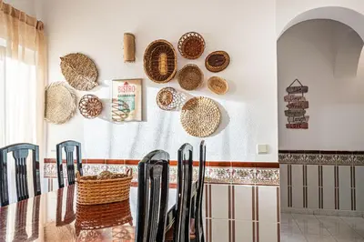 a dining room with a table and plates on the wall at BeGuest Santa Eulália Apartment in Albufeira