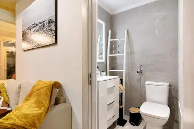 a small bathroom with a toilet and a sink at Casa na Travessa in Faro