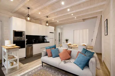 a living room with a couch and a table at Casa na Travessa in Faro