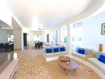 a large living room with couches and a table at Superb Vilamoura Villa 5 Bedrooms Villa Azul Walking Distance To Marina in Quarteira