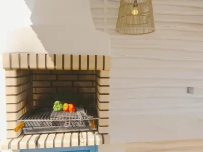 a brick oven with some vegetables on a rack at Superb Vilamoura Villa 5 Bedrooms Villa Azul Walking Distance To Marina in Quarteira