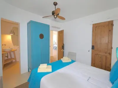a bedroom with a blue cabinet and a bed at Superb Vilamoura Villa 5 Bedrooms Villa Azul Walking Distance To Marina in Quarteira
