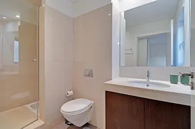 a bathroom with a toilet and a sink and a shower at Victoria Secret in Vilamoura