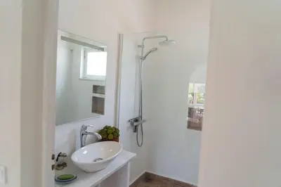 a white bathroom with a sink and a shower at Beautiful private Villa with pool, Boliqueime, Loulé in Boliqueime