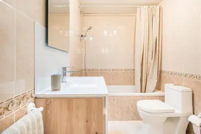 a bathroom with a sink and a toilet and a shower at Albufeira Holidays Near The Strip in Albufeira