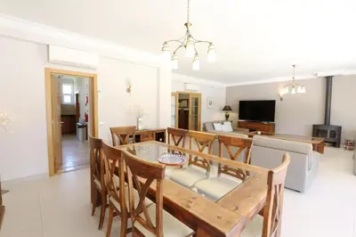 a dining room and kitchen with a table and chairs at Luxury Vilamoura Villa 4 Bedrooms Villa Corvo Billiards in Quarteira