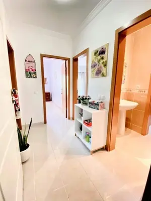 a room with a bathroom with a sink and a cabinet at Flamingos Apartment with 2 swimming pool com check in e check out ao domingo em julho e agosto in Albufeira