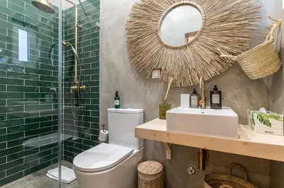 a bathroom with a toilet and a sink and a shower at @ rita'splace in Faro
