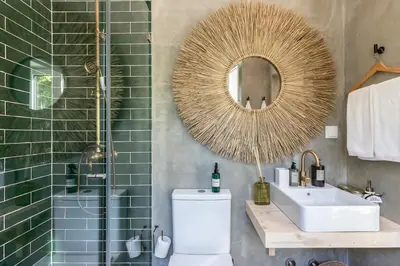 a bathroom with a sink toilet and a mirror at @ rita'splace in Faro