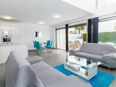 a living room with a couch and a table at Harmony 4B House by Stay ici Algarve Holiday Rental in Albufeira