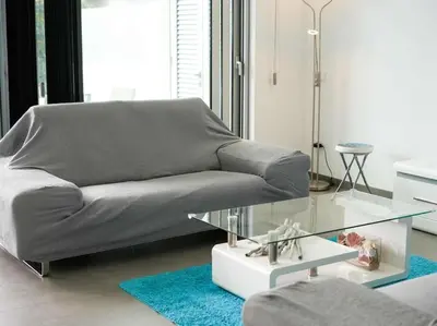 a living room with a couch and a glass table at Harmony 4B House by Stay ici Algarve Holiday Rental in Albufeira