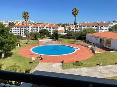 a view of a swimming pool from a balcony at Apart 306 in Albufeira