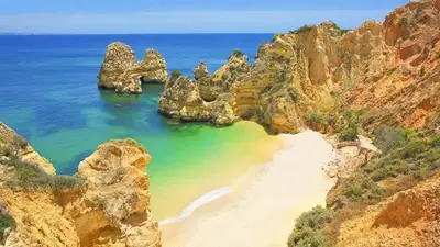 an aerial view of a beach between two rocky cliffs at AlbufeiraOrada II by Be Cherish in Albufeira