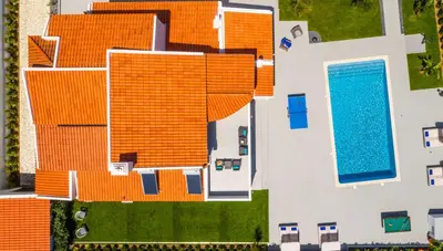 an aerial view of a house with an orange roof at Villa Sequeira in Albufeira